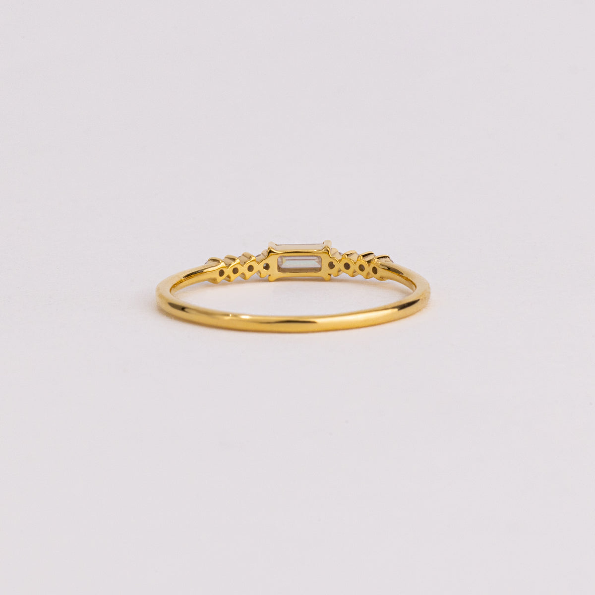 East West Emerald Cut Lab Grown Diamond Ring, Graduated Round Diamond Band