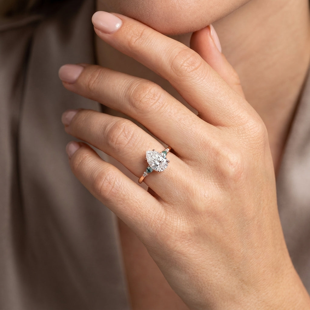 Pear Cut Lab Grown Diamond Engagement Ring, Teal Sapphire Side Stones, Rose Gold Three Stone Proposal Ring