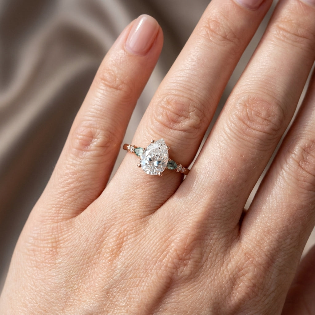 Pear Cut Lab Grown Diamond Engagement Ring, Teal Sapphire Side Stones, Rose Gold Three Stone Proposal Ring